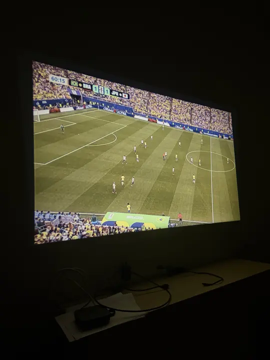 A football match projected on a wall during a FIFA screening