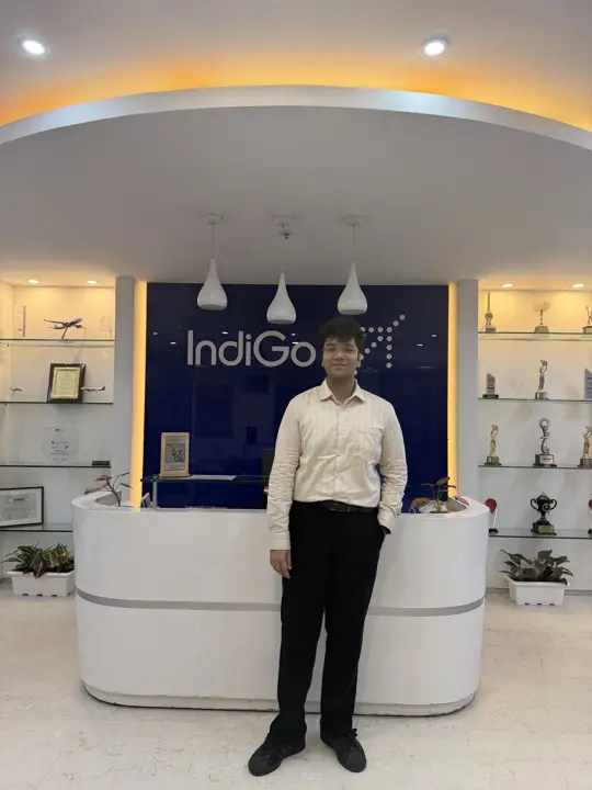 Eshan standing at the IndiGo reception on a client visit